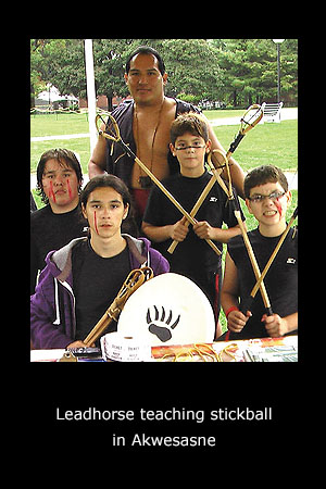 Leadhorse teaching stickball in Akwesasne